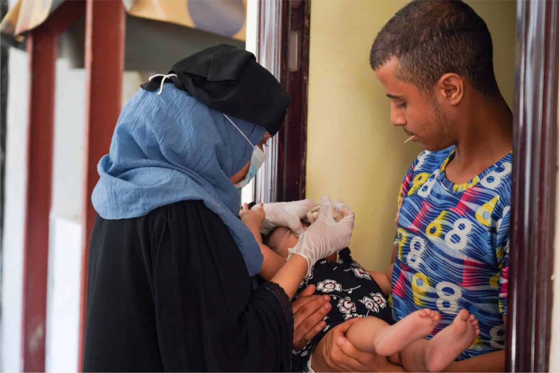 child receiving their Polio immunization in Yemen